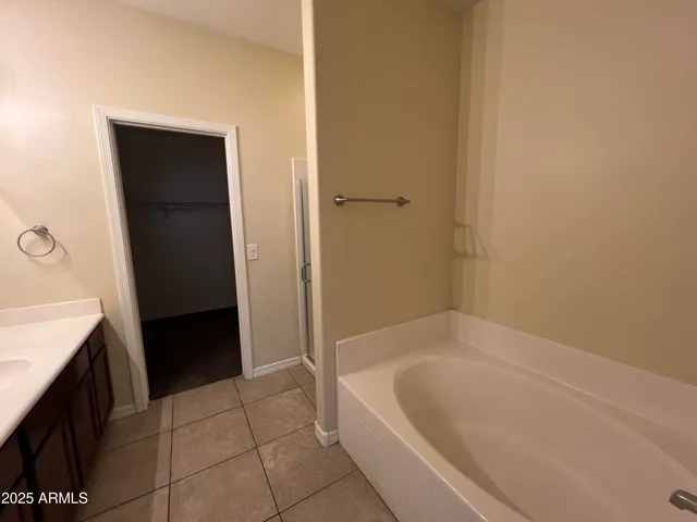 a bathroom with a bathtub and a sink