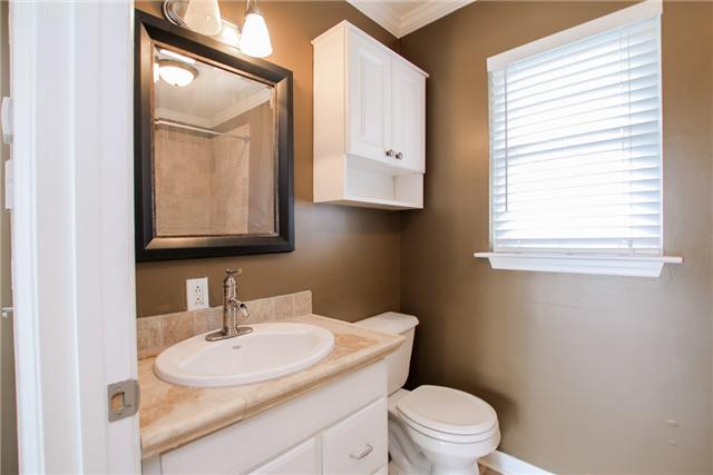 708 Pebble Point Road Lebanon, TN 37087 - Photo 14 of 20 a bathroom with a toilet a sink and a mirror