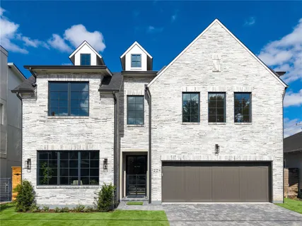a living room with furniture a fireplace and a floor to ceiling window