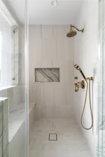 a view of a porch with a table and chairs next to a yard