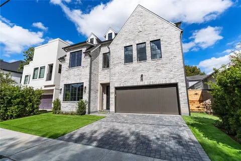 a view of a house with a yard and porch