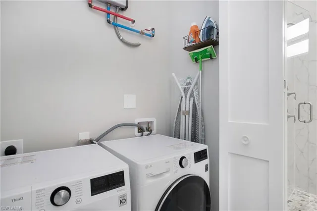 a utility room with dryer and washer