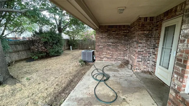 a backyard of a house with lots of green space and seating