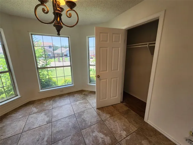 a view of an entryway door with wooden floor