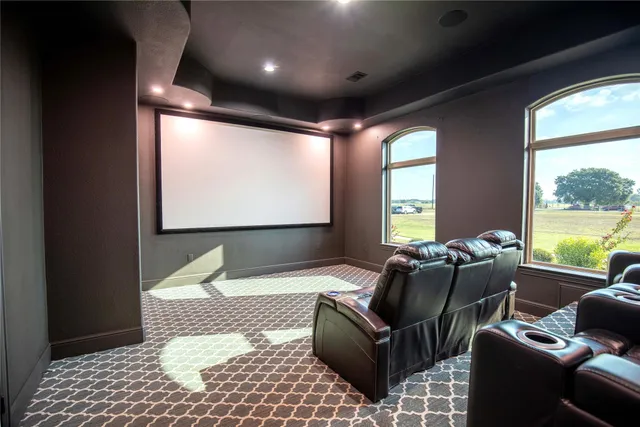 a spacious bedroom with a bed and a large window