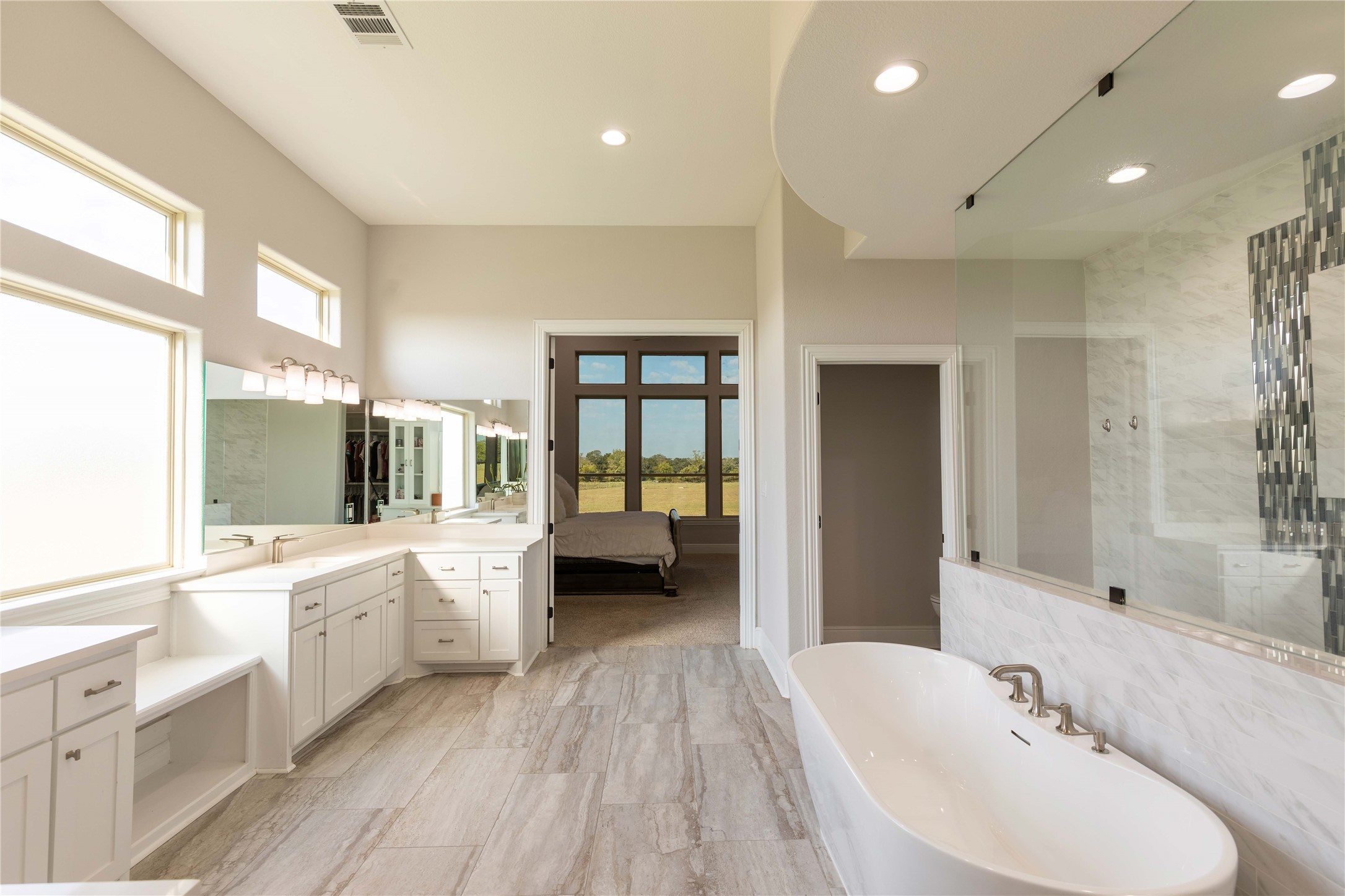 24445 Farm To Market 1887 Hempstead, TX 77445 - Photo 19 of 36 a bathroom with a sink a large mirror and a bathtub