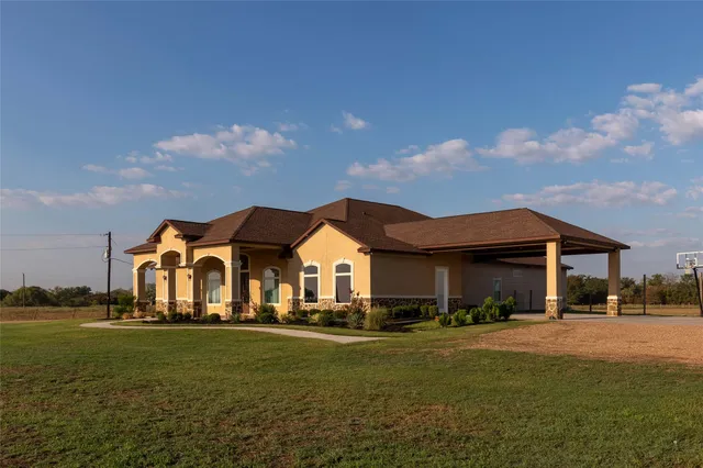 a front view of a house with a yard