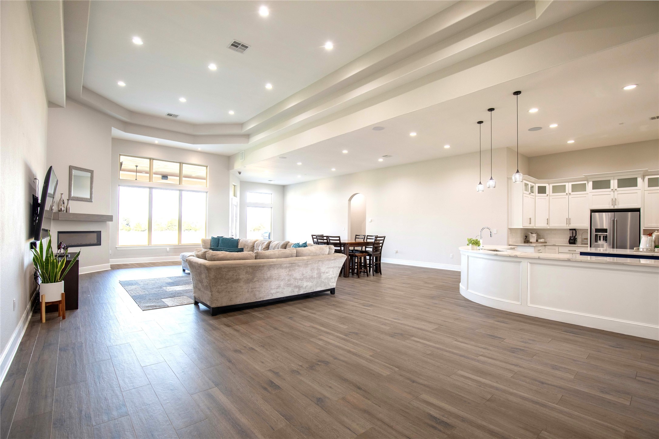 24445 Farm To Market 1887 Hempstead, TX 77445 - Photo 6 of 36 a large kitchen with kitchen island a large counter top space a sink stainless steel appliances and cabinets