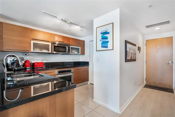 a kitchen with stainless steel appliances and a sink