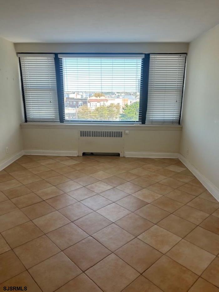 101 South Raleigh Avenue, Unit 521 Atlantic City, NJ 08401 - Photo 9 of 19 an empty room with windows