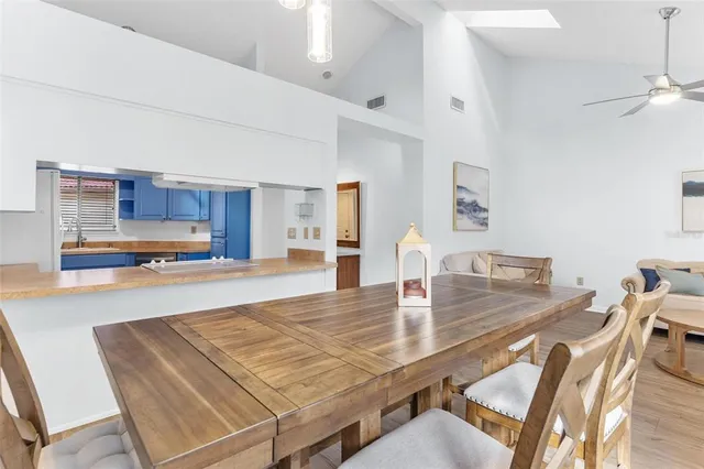 a kitchen with stainless steel appliances granite countertop wooden cabinets and a sink