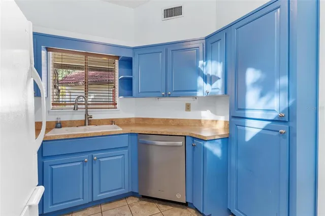 a bedroom with a bed and a chair