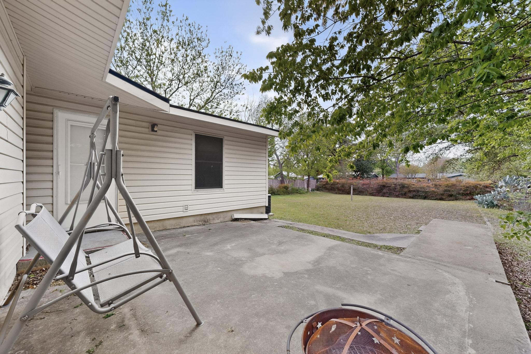 6808 Daugherty Street Austin, TX 78757 - Photo 16 of 20 a view of a backyard with a patio