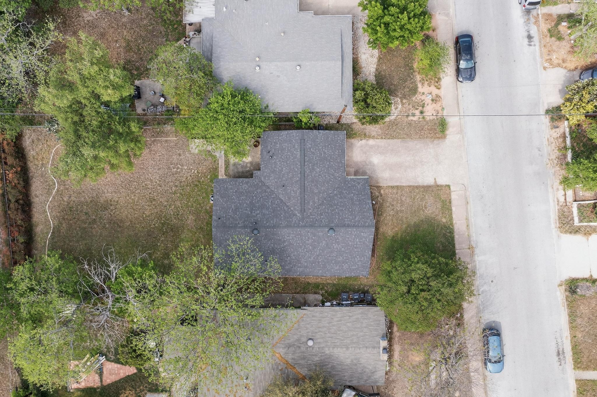 6808 Daugherty Street Austin, TX 78757 - Photo 3 of 20 an aerial view of a house with a yard and a large tree