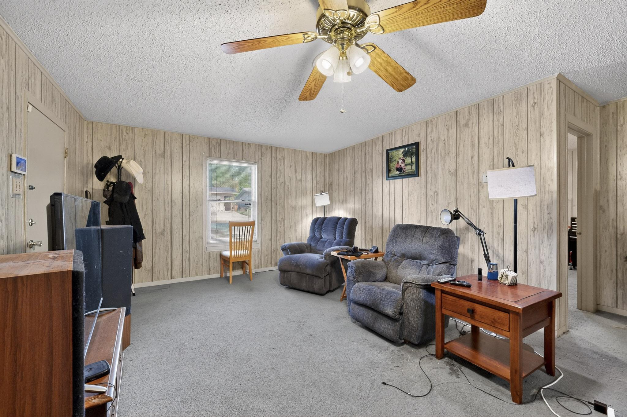 6808 Daugherty Street Austin, TX 78757 - Photo 8 of 20 a living room with furniture and a flat screen tv
