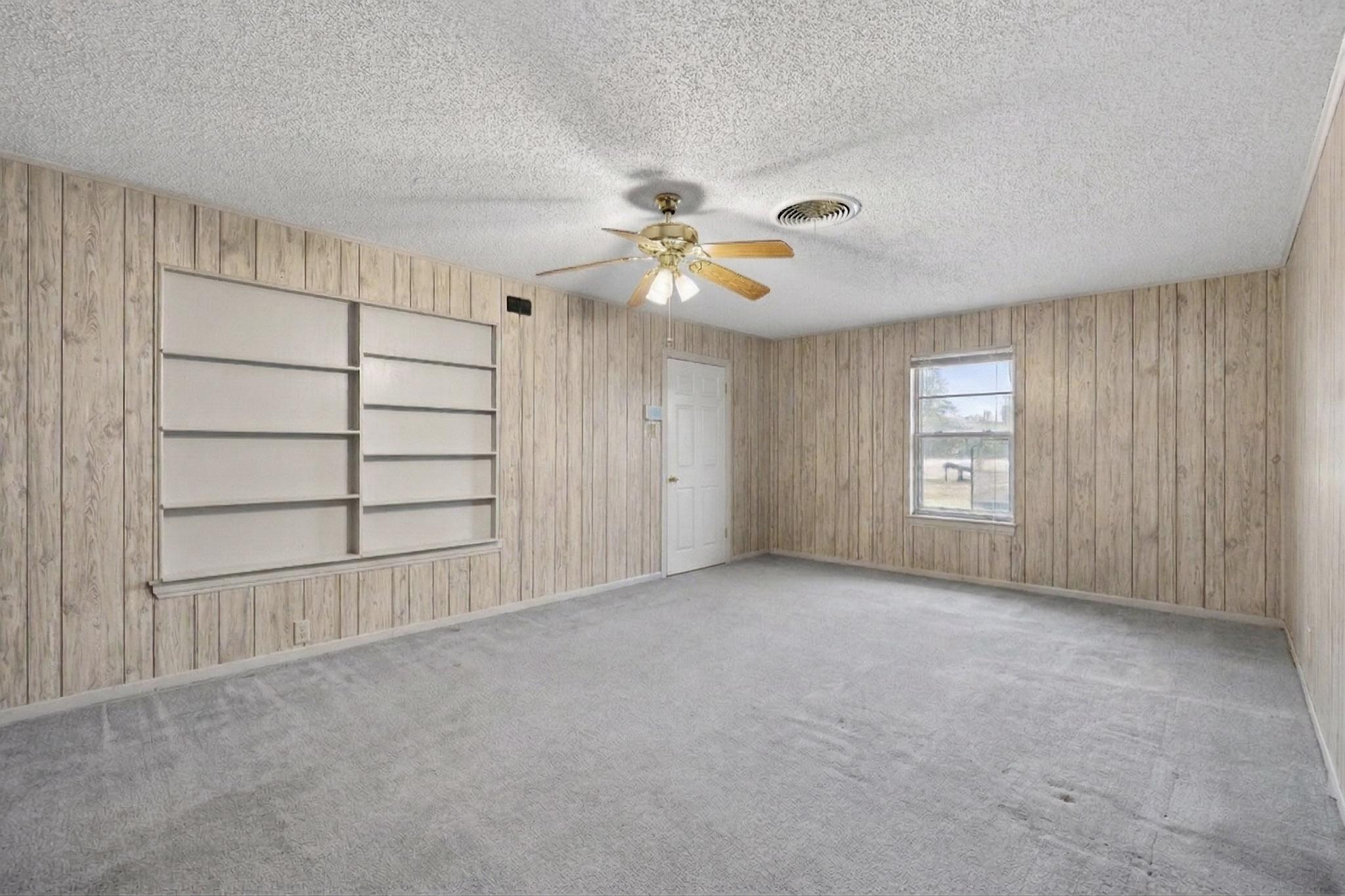 6808 Daugherty Street Austin, TX 78757 - Photo 10 of 20 wooden floor in an empty room with a window