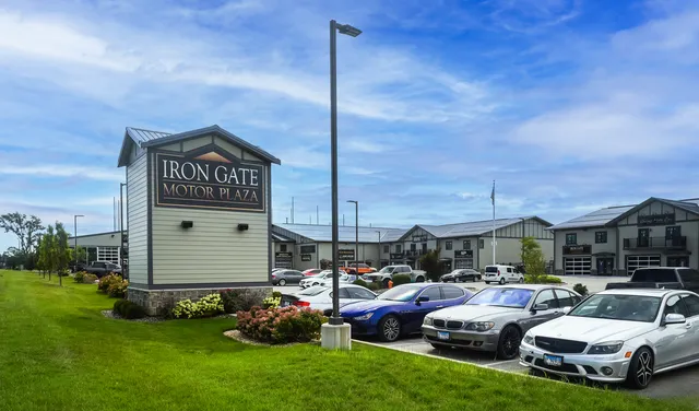 a couple of cars parked in front of house