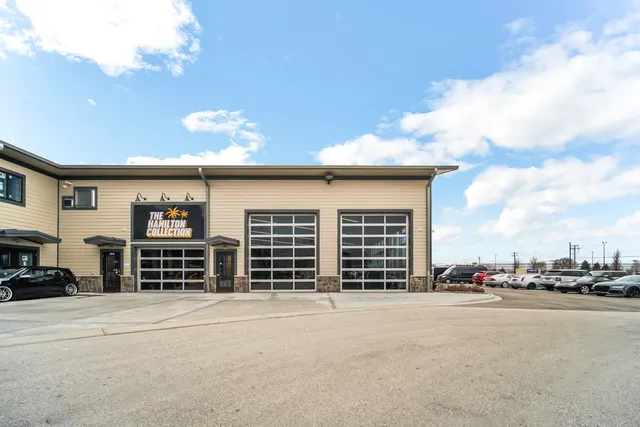 a view of building with car parked