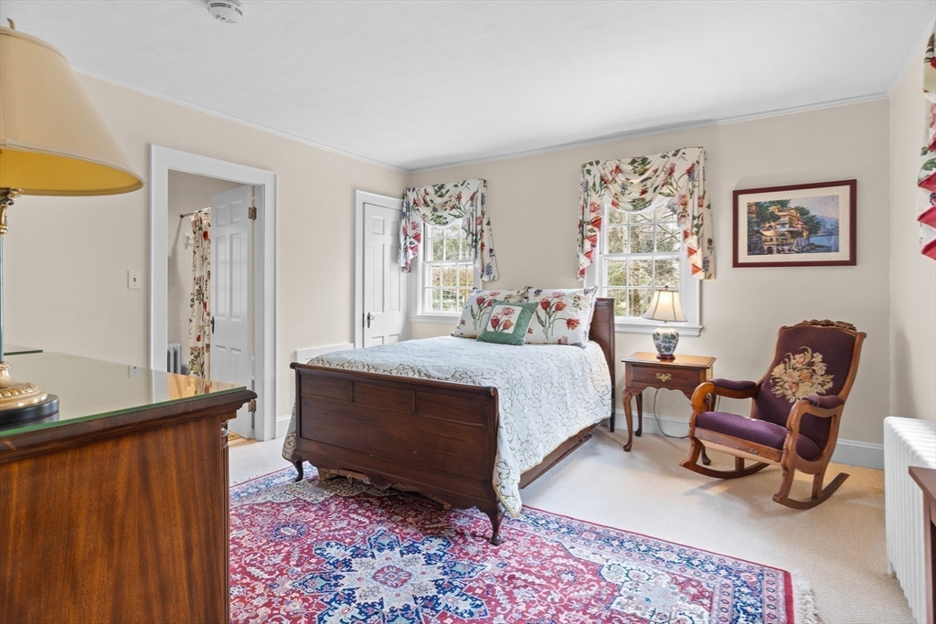 29 Woodcliff Road Wellesley, MA 02481 - Photo 13 of 31 a bed room with a bed and a chair