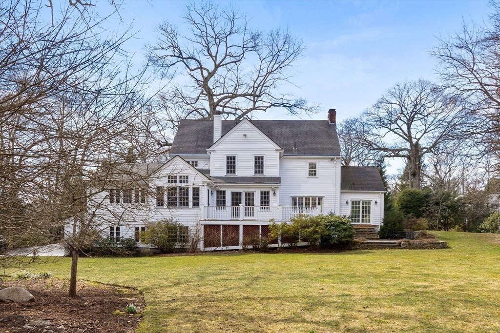 29 Woodcliff Road Wellesley, MA 02481 - Photo 2 of 31 a house that has a large tree in a yard next to a building