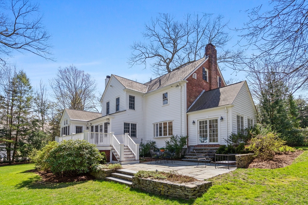 29 Woodcliff Road Wellesley, MA 02481 - Photo 27 of 31 a view of house with yard outdoor seating and covered with trees