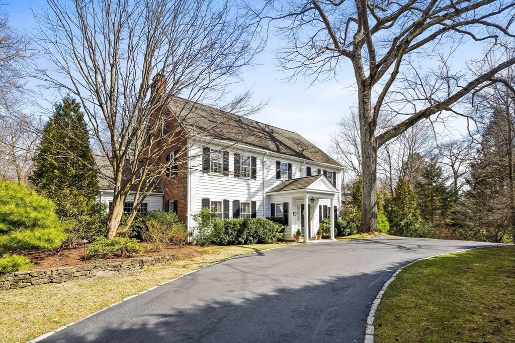 29 Woodcliff Road Wellesley, MA 02481 - Photo 29 of 31 a front view of a house with a yard and trees