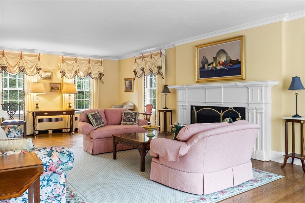 29 Woodcliff Road Wellesley, MA 02481 - Photo 5 of 31 a living room with furniture large window and a fireplace