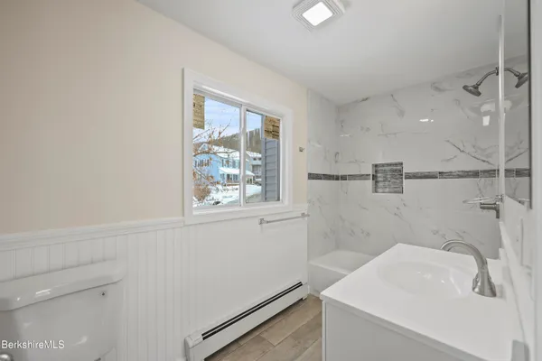 a bathroom with a sink and a shower