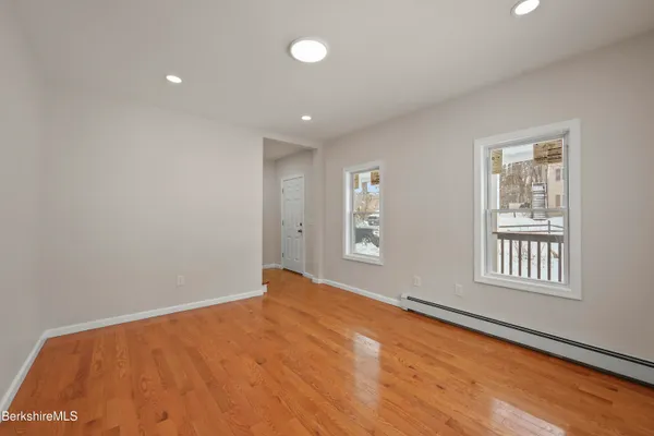 a view of an empty room with a window