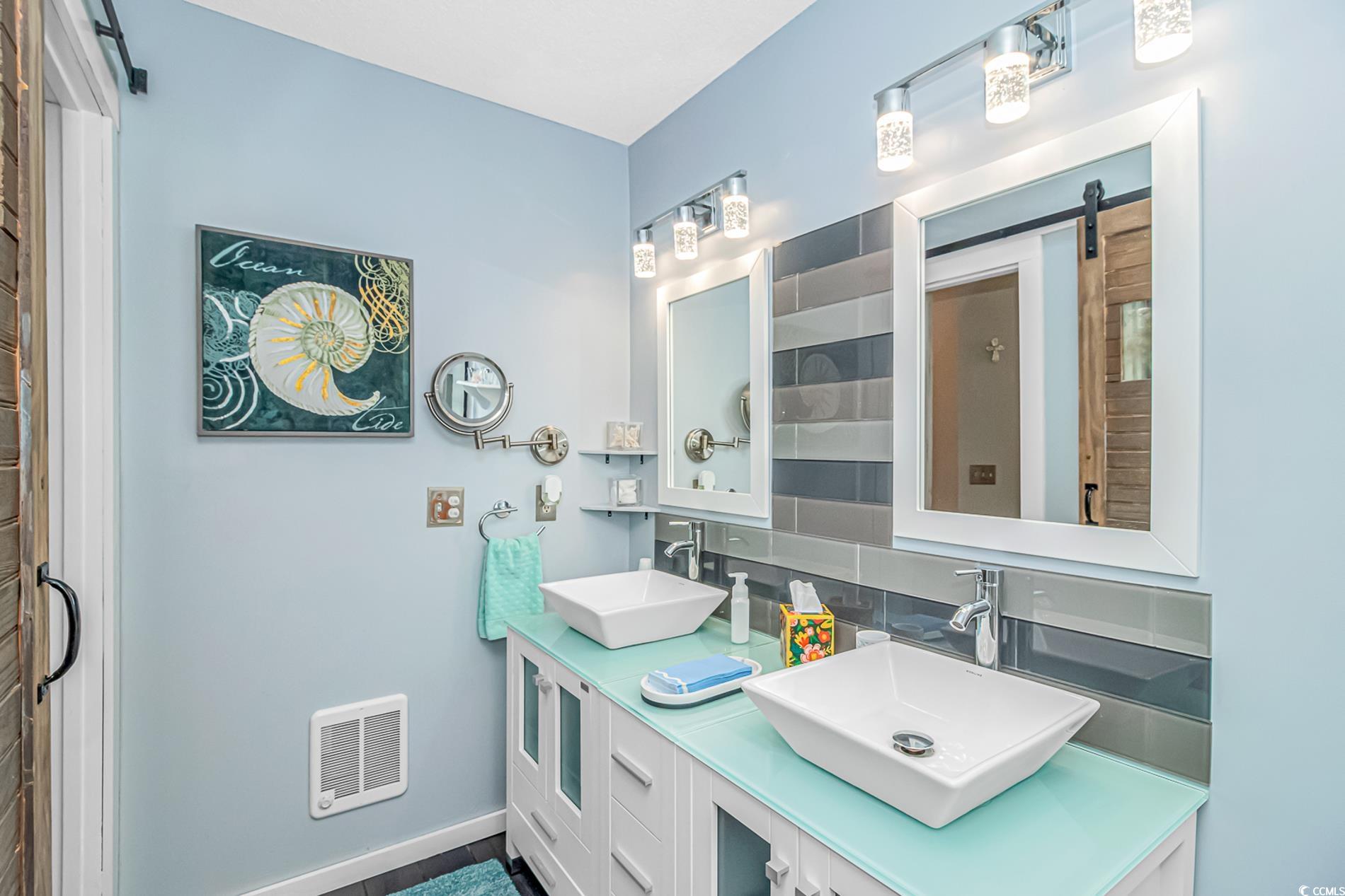 4394 Daphne Lane, Unit G Murrells Inlet, SC 29576 - Photo 29 of 30 Full bathroom with double vanity and backsplash