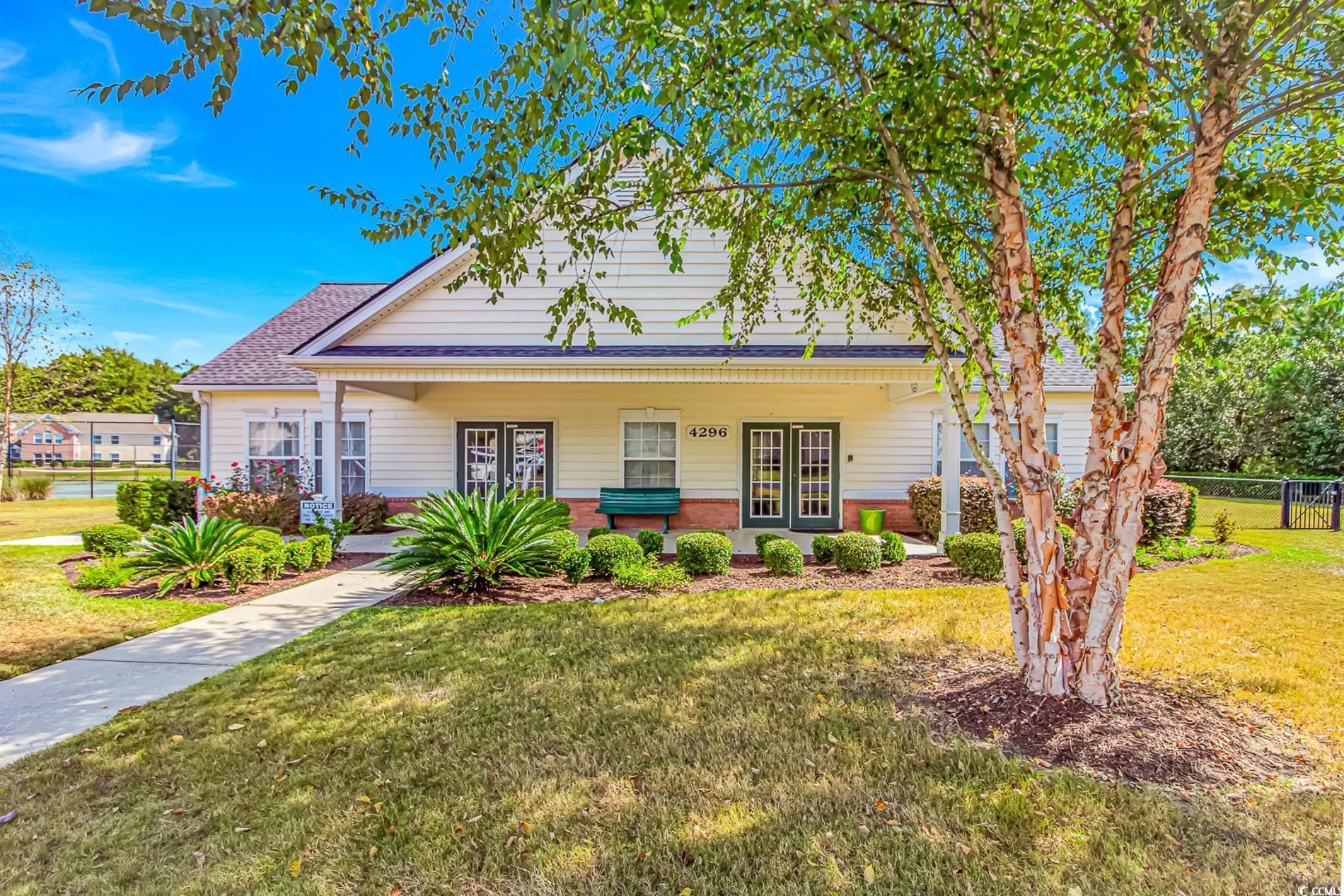 4394 Daphne Lane, Unit G Murrells Inlet, SC 29576 - Photo 3 of 30 Bungalow featuring covered porch, brick siding, and roof with shingles