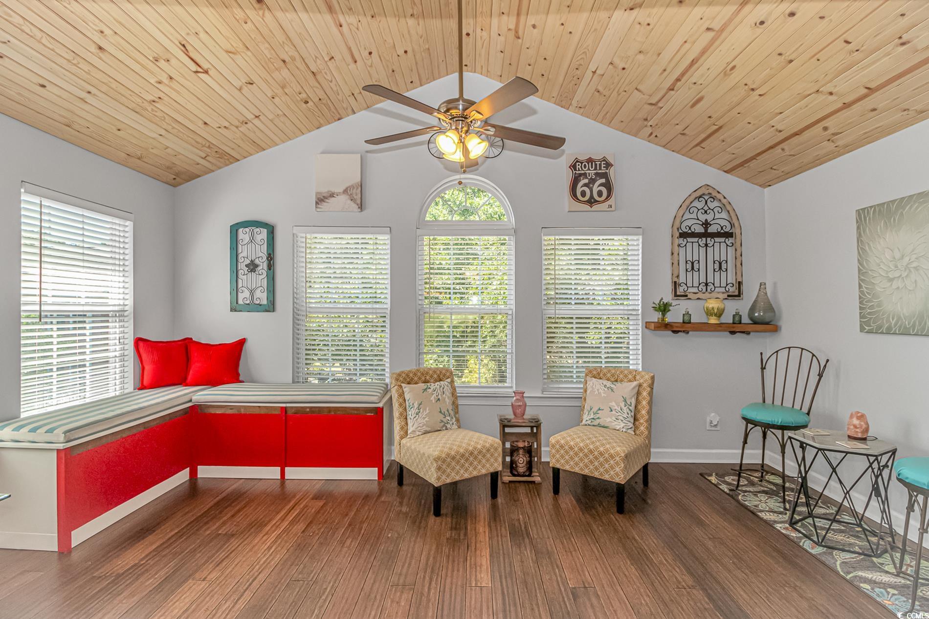4394 Daphne Lane, Unit G Murrells Inlet, SC 29576 - Photo 10 of 30 Living area with dark wood-style flooring, lofted ceiling, and ceiling fan