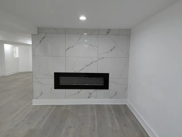 a bathroom with a toilet sink and shower