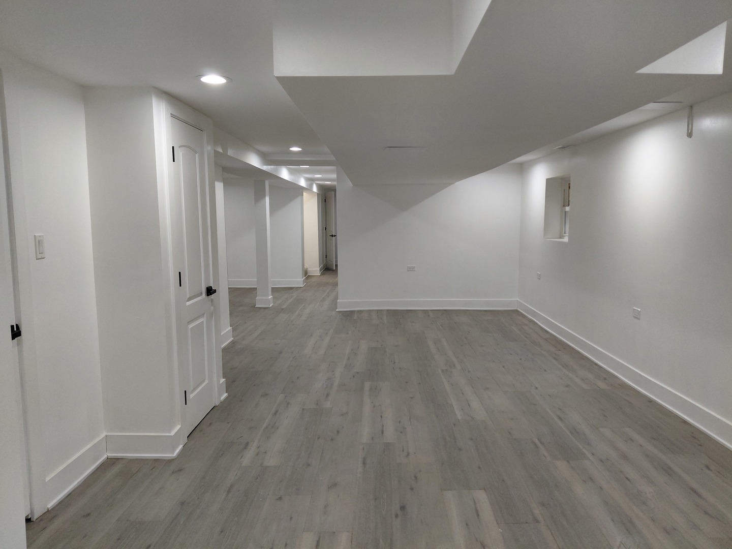 6441 South Campbell Avenue Chicago, IL 60629 - Photo 19 of 24 an empty room with wooden floor and windows