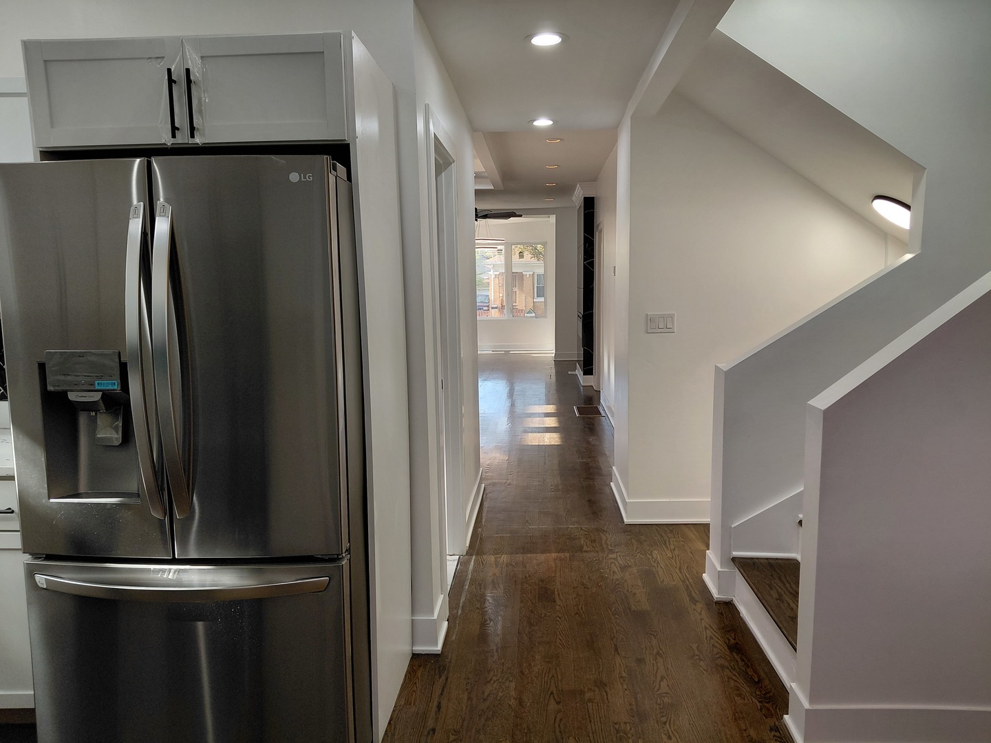 6441 South Campbell Avenue Chicago, IL 60629 - Photo 10 of 24 a view of a refrigerator in kitchen and an empty room