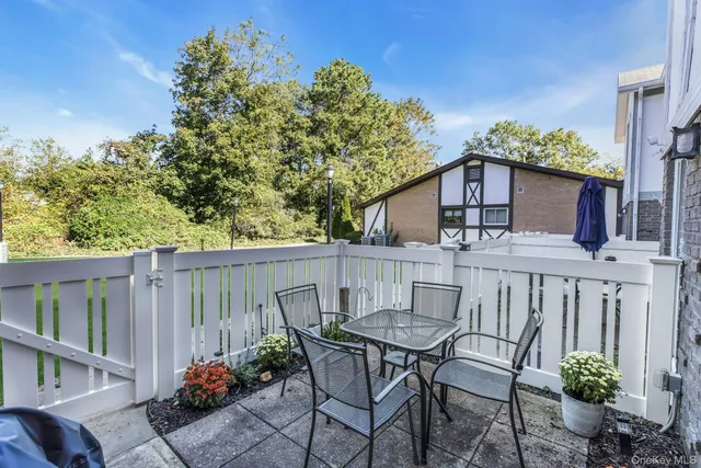 a view of a chairs and table in the patio