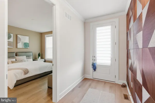 an aerial view of a swimming pool with outdoor seating