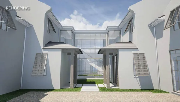 a front view of a house with a garden