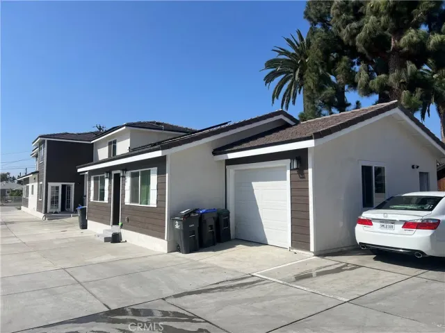 a view of a car parked in front of house