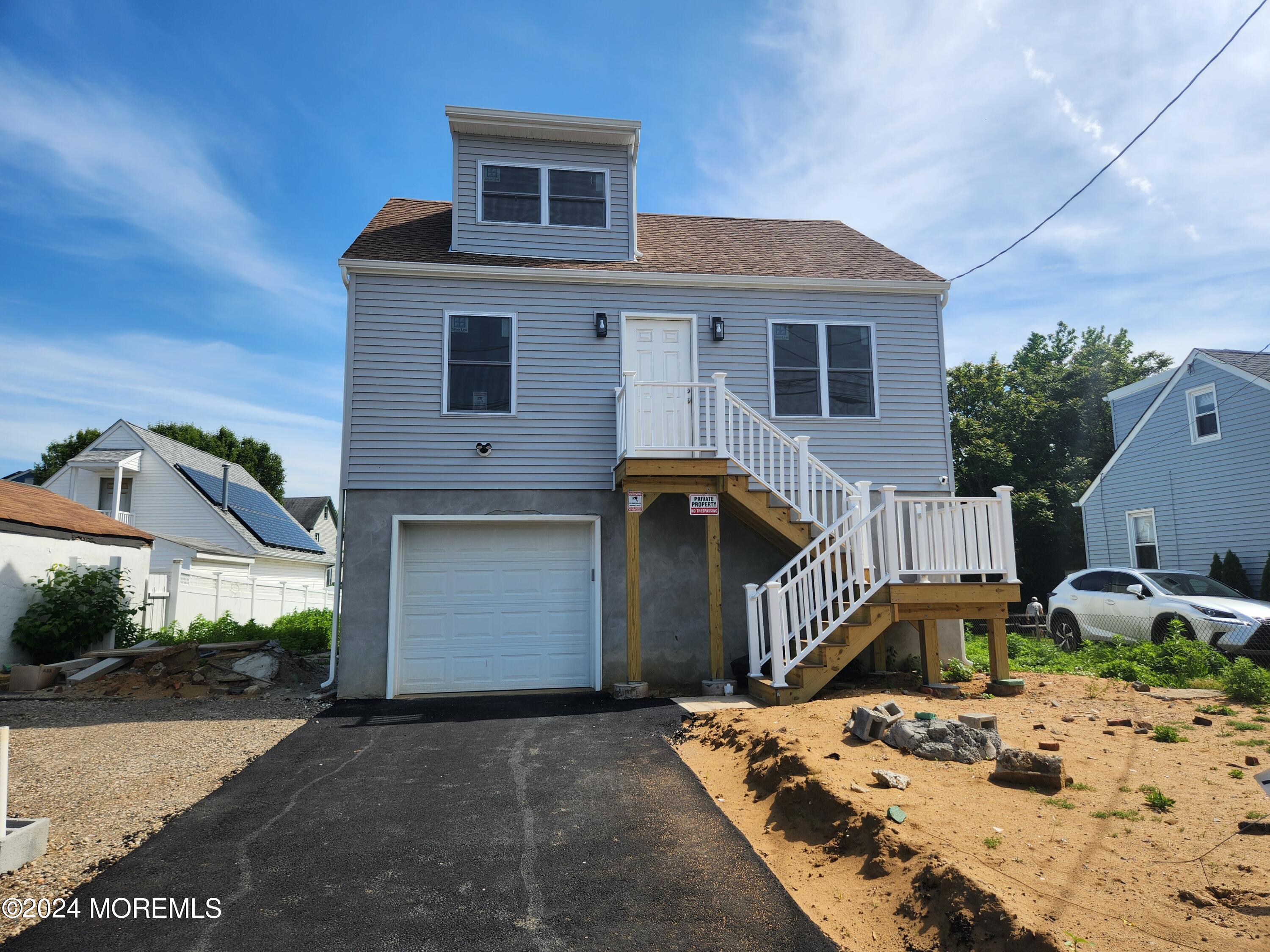 124 Victoria Place Union Beach, NJ 07735 - Photo 1 of 29 a front view of a house with garden