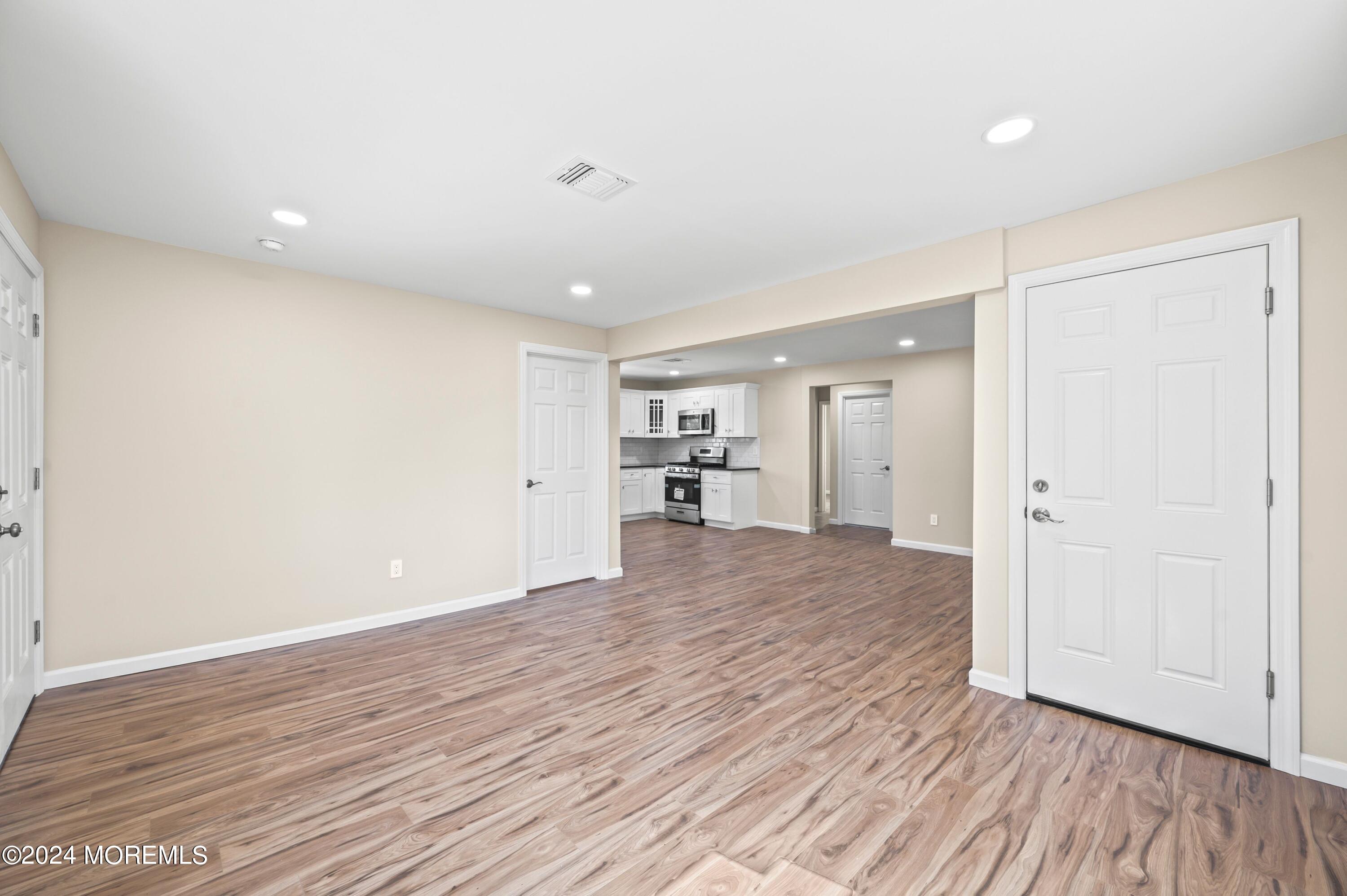 124 Victoria Place Union Beach, NJ 07735 - Photo 2 of 29 a view of empty room with wooden floor