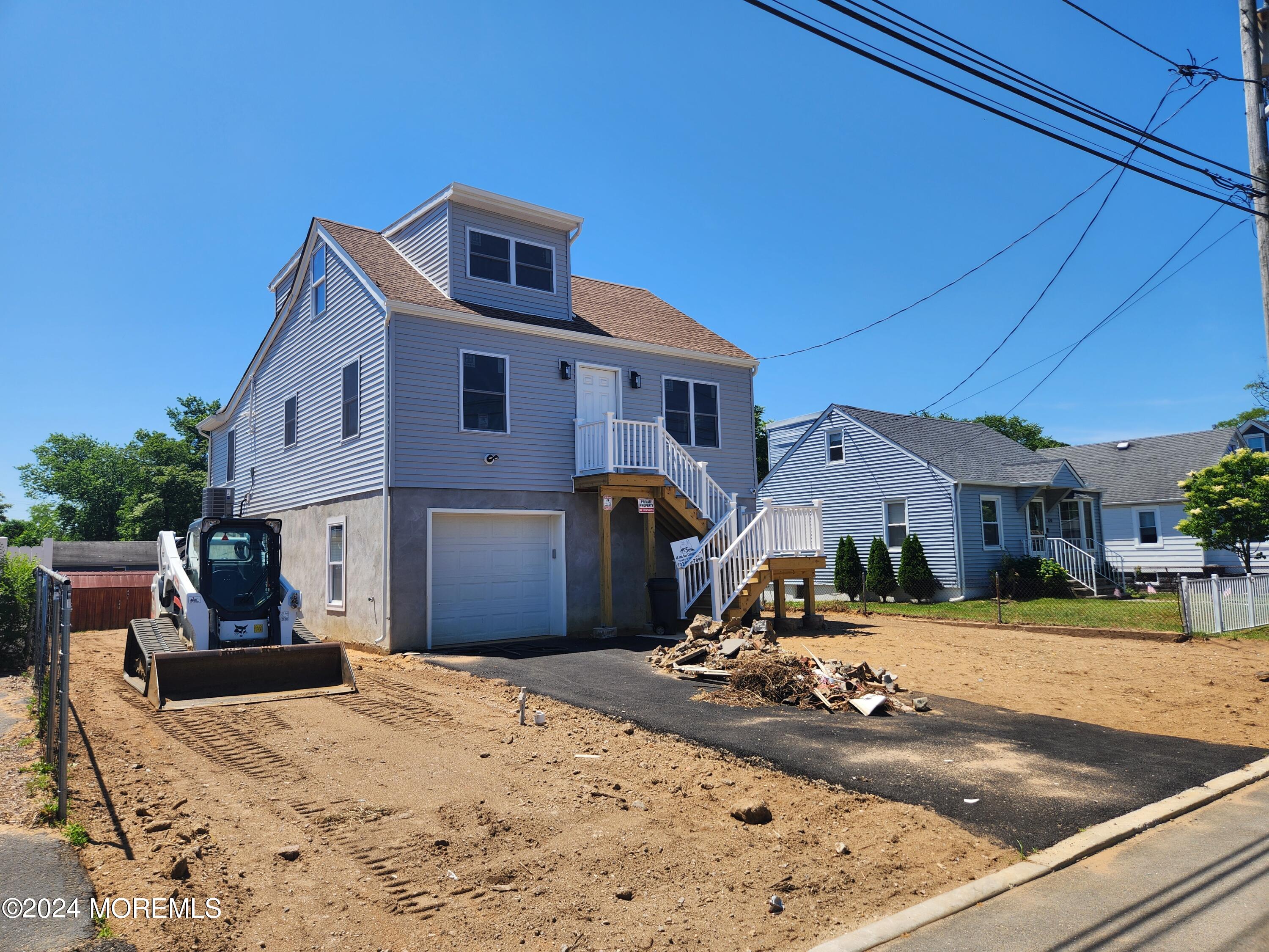 124 Victoria Place Union Beach, NJ 07735 - Photo 25 of 29 a front view of a house with a yard