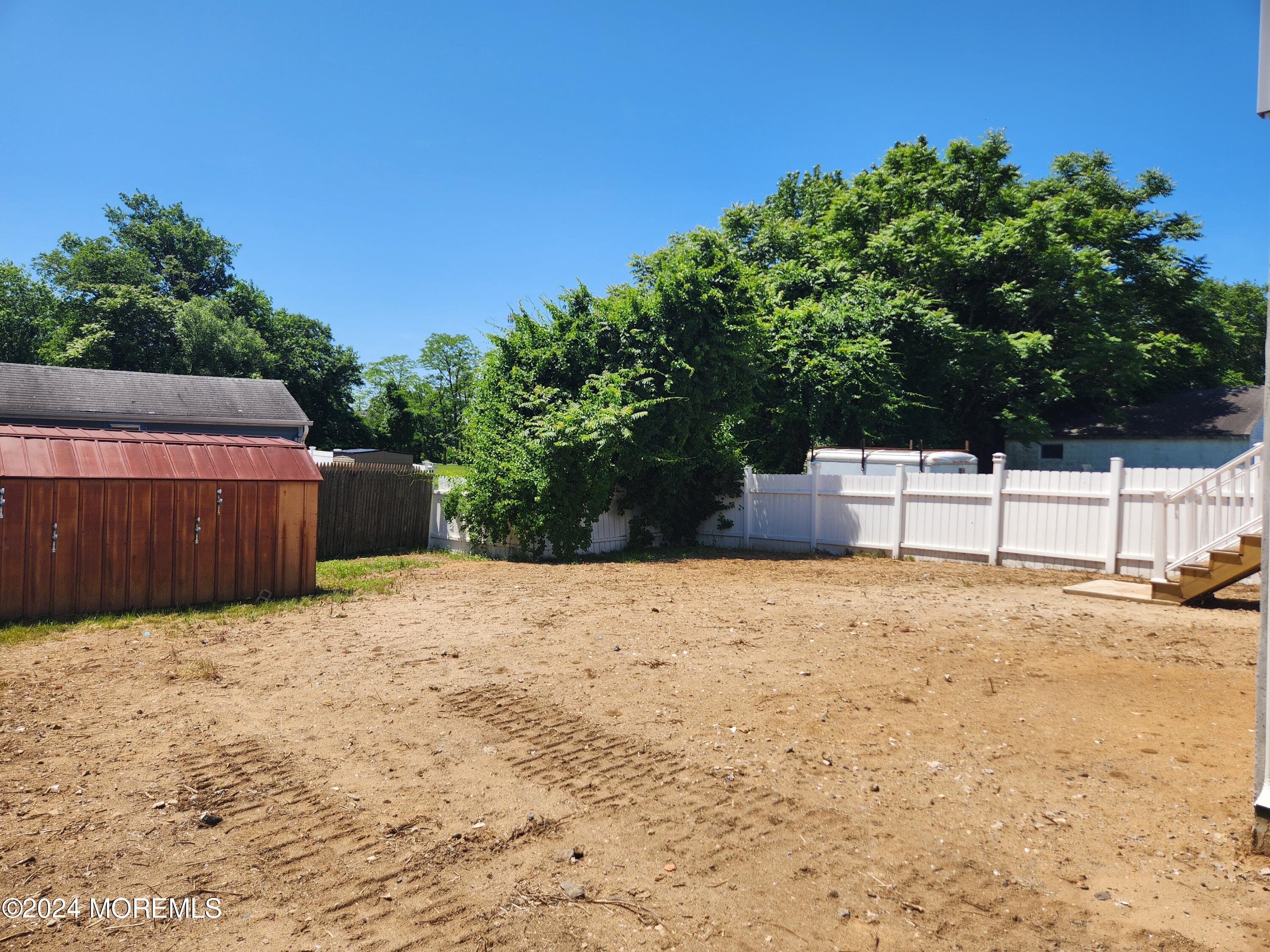 124 Victoria Place Union Beach, NJ 07735 - Photo 26 of 29 a backyard of a house