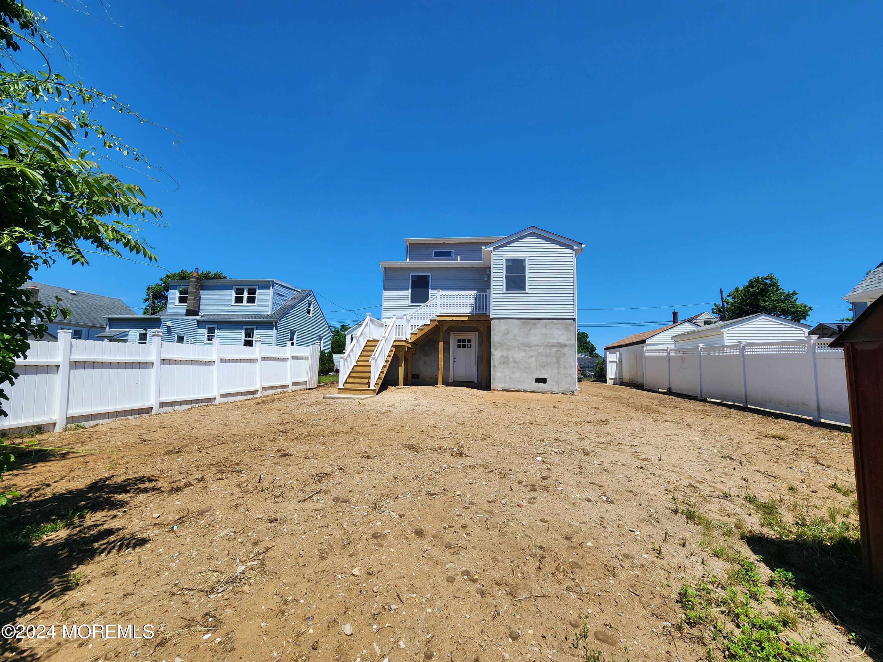 124 Victoria Place Union Beach, NJ 07735 - Photo 28 of 29 a bed room with a bed and a chair