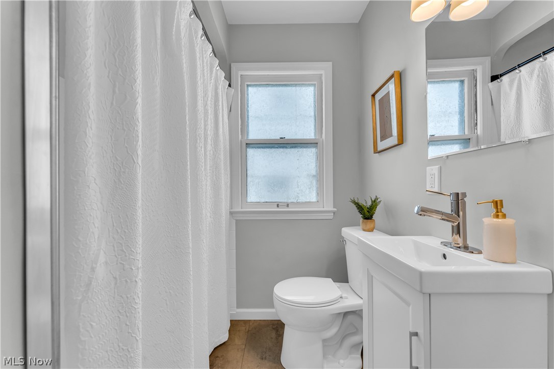 1828 South Green Road Cleveland, OH 44121 - Photo 18 of 30 Bathroom with plenty of natural light, oversized vanity, and toilet