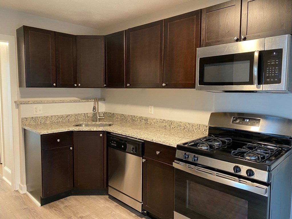200 Congress Avenue, Unit 3 Chelsea, MA 02150 - Photo 1 of 14 a kitchen with a stove and a microwave
