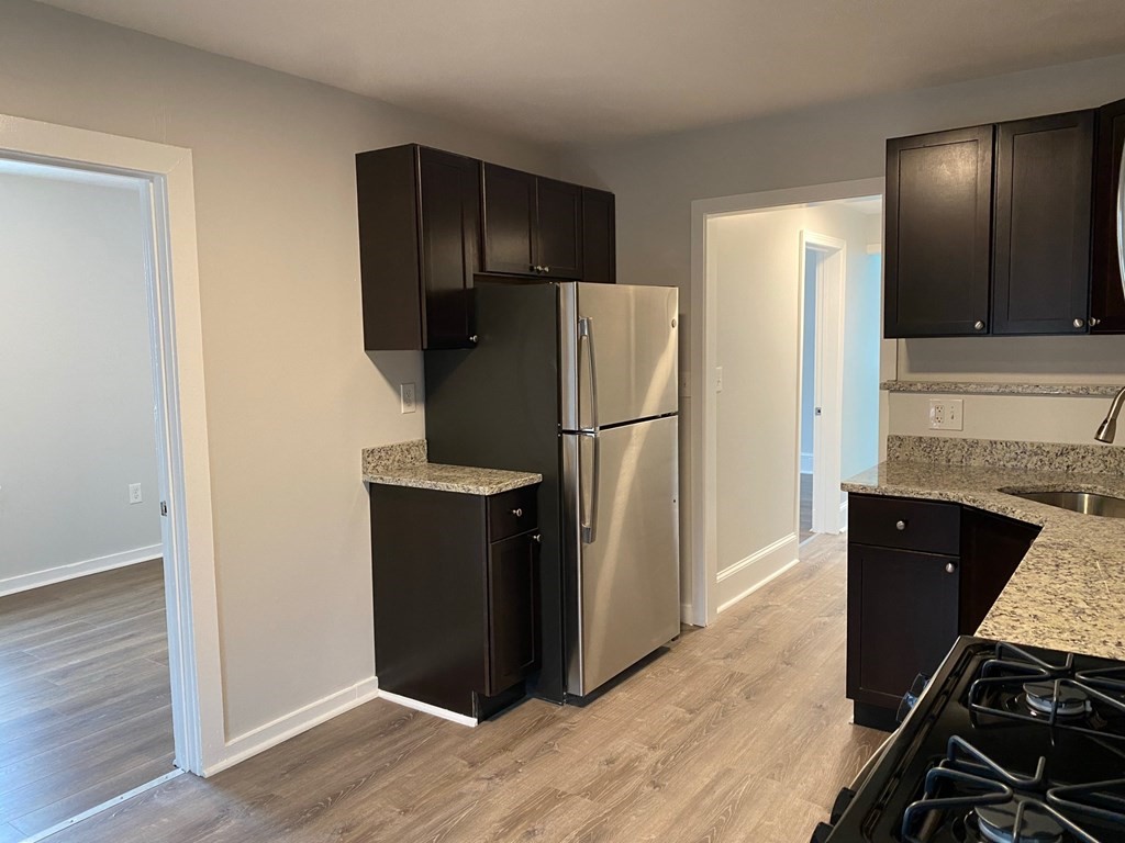 200 Congress Avenue, Unit 3 Chelsea, MA 02150 - Photo 2 of 14 a kitchen with a refrigerator and a stove top oven