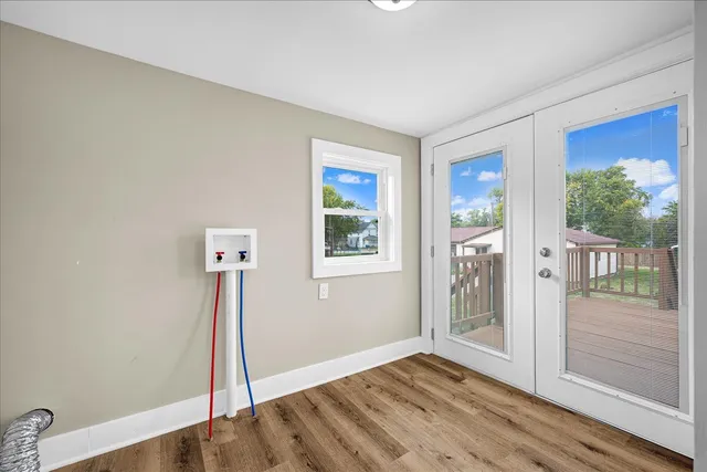 a view of an empty room with glass door