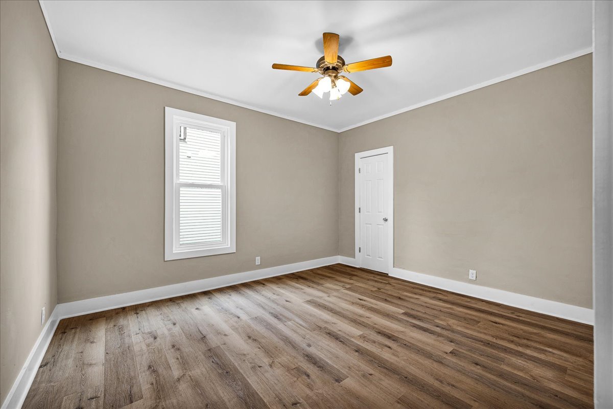 222 West Chestnut Street Hoopeston, IL 60942 - Photo 12 of 28 wooden floor in an empty room with a window