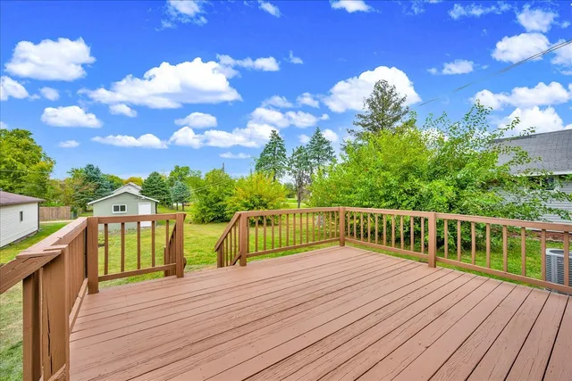 a balcony with wooden floor
